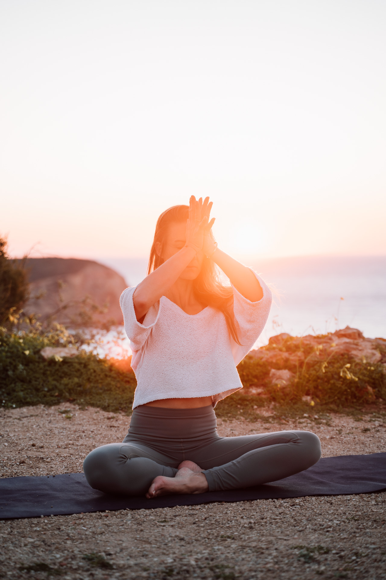 Wellness coach branding photography Algarve – meditation practice at sunset